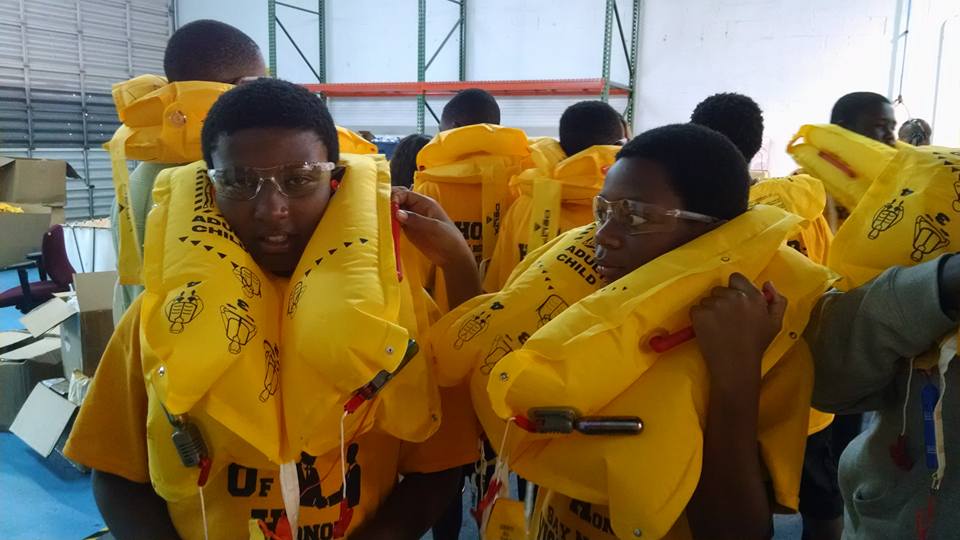 Students in yellow uniform and air bags