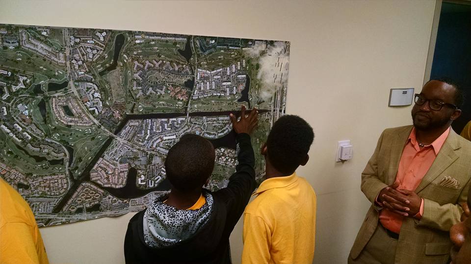 Students observing the map on the wall